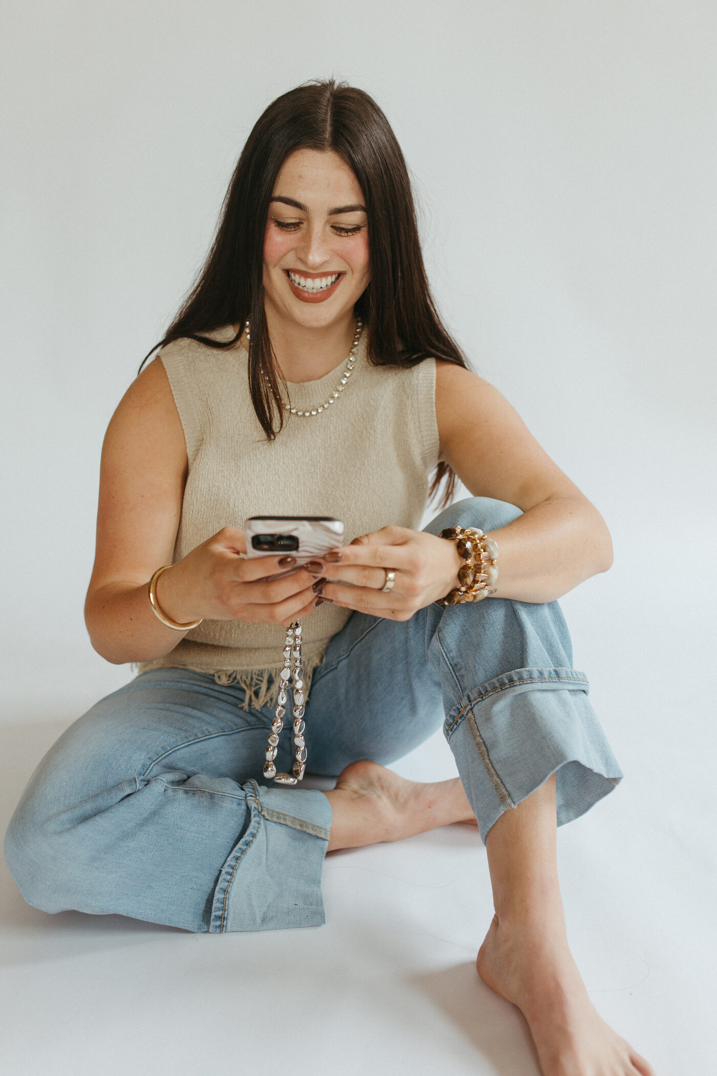Morgan Bartow reviewing content on her phone