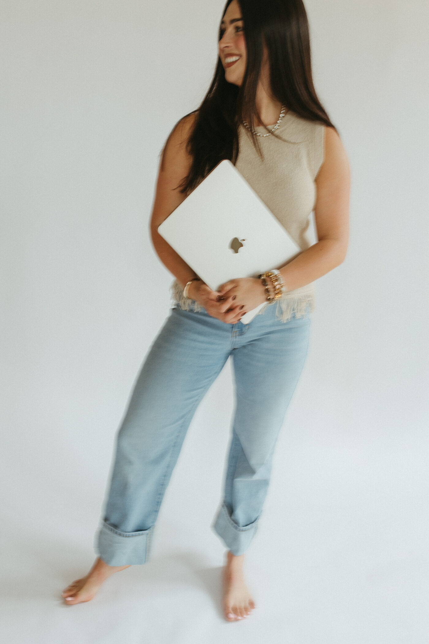 Morgan Bartow holding a laptop